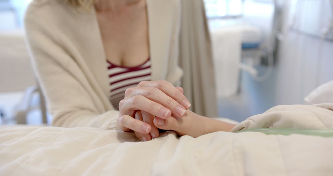 Close-up of woman holding patient's hand in hospital - Free Images, Stock Photos and Pictures on Pikwizard.com