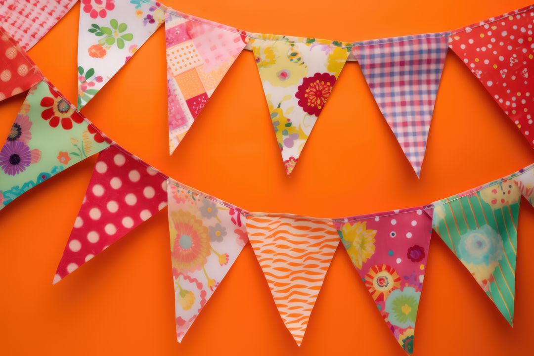 Colorful Bunting Flags on Bright Orange Background - Free Images, Stock Photos and Pictures on Pikwizard.com
