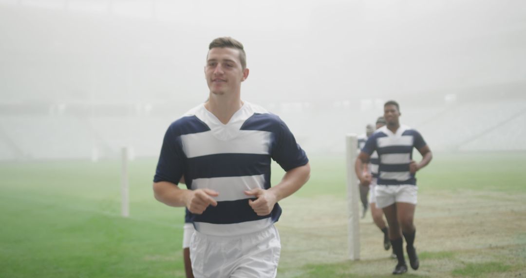 Rugby Players Warming Up in Foggy Stadium - Free Images, Stock Photos and Pictures on Pikwizard.com