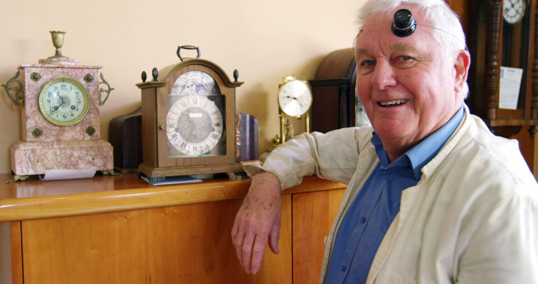 Senior Clockmaker in Workshop with Antique Clocks - Free Images, Stock Photos and Pictures on Pikwizard.com