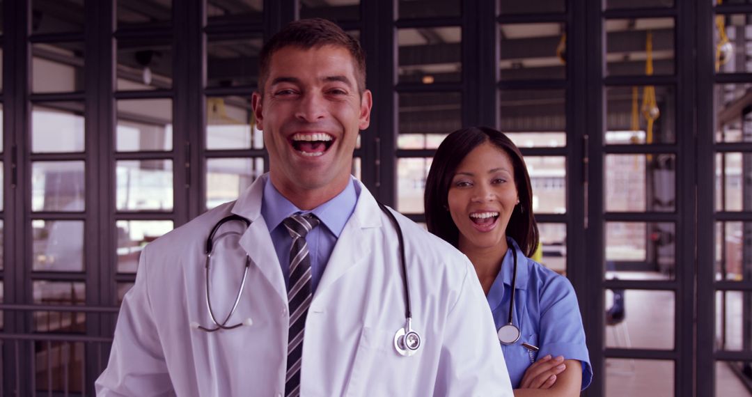 Smiling Medical Professionals Standing Together in Hospital - Free Images, Stock Photos and Pictures on Pikwizard.com