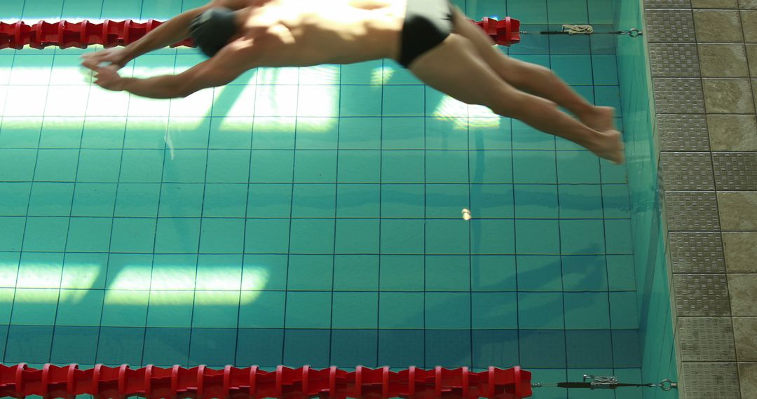 Male Swimmer Diving into Clear Swimming Pool Racing Lane - Free Images, Stock Photos and Pictures on Pikwizard.com