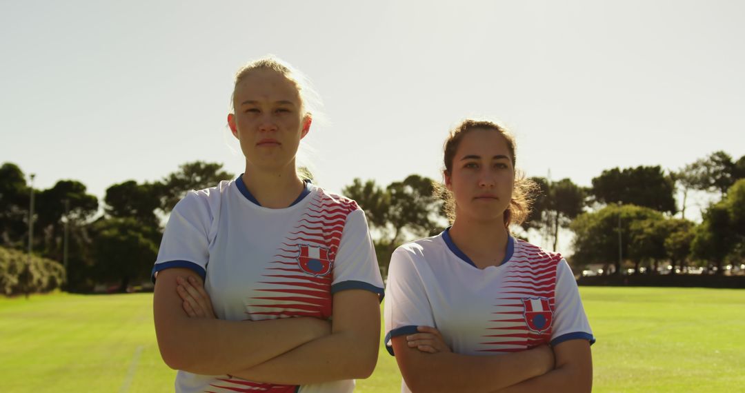 Female Soccer Players Standing Confidently on Field - Free Images, Stock Photos and Pictures on Pikwizard.com