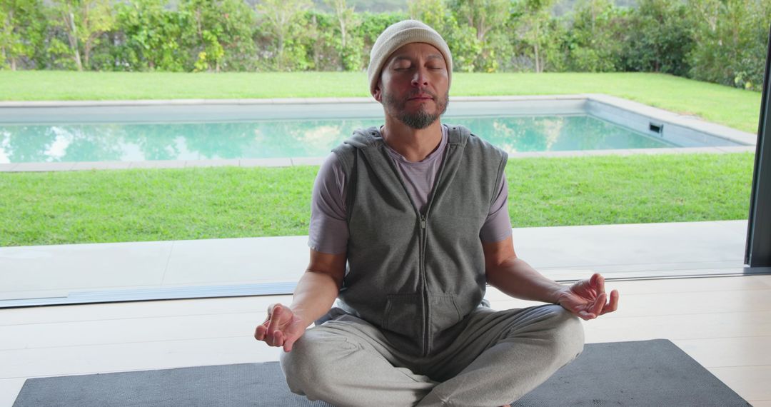 Serene Meditation by Indoor Pool in Modern Home