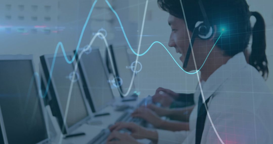 Asian Businessman Analyzing Financial Data with Modern Technology Interfaces