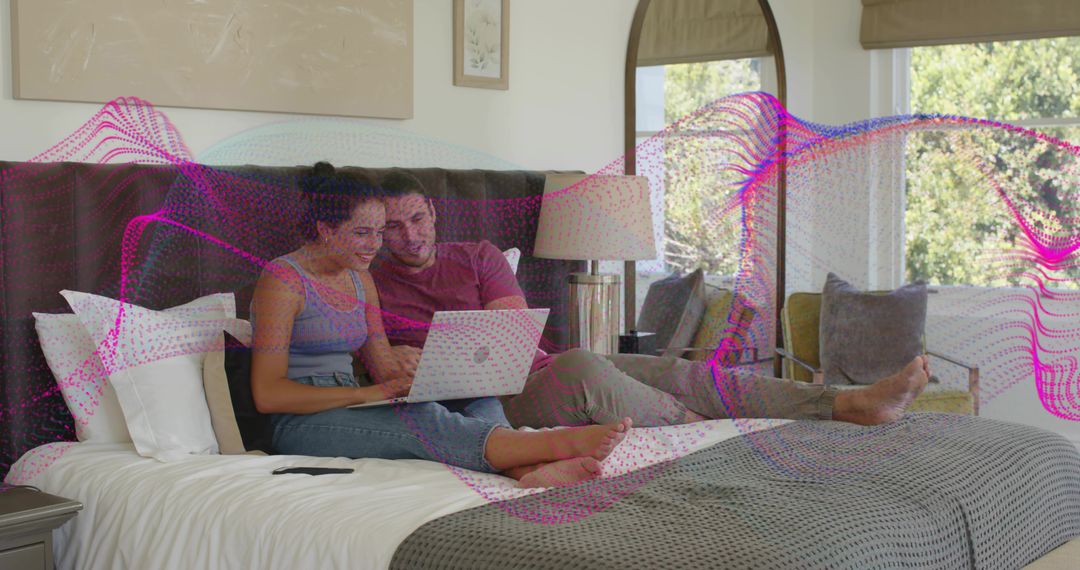 Couple Relaxing on Bed Browsing Laptop with Magenta Digital Wave Overlay