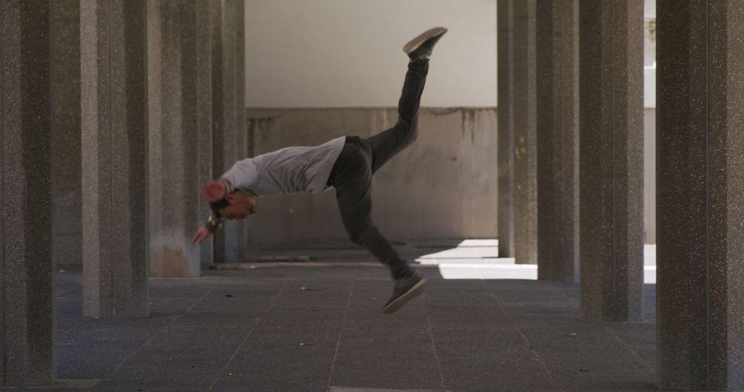 Urban Active Young Man Breakdancing in Modern Concrete Structure - Free Images, Stock Photos and Pictures on Pikwizard.com