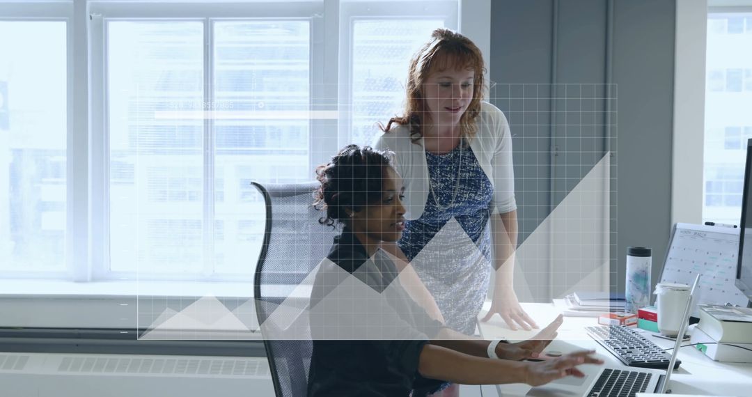 Businesswomen Analyzing Financial Data on Computer