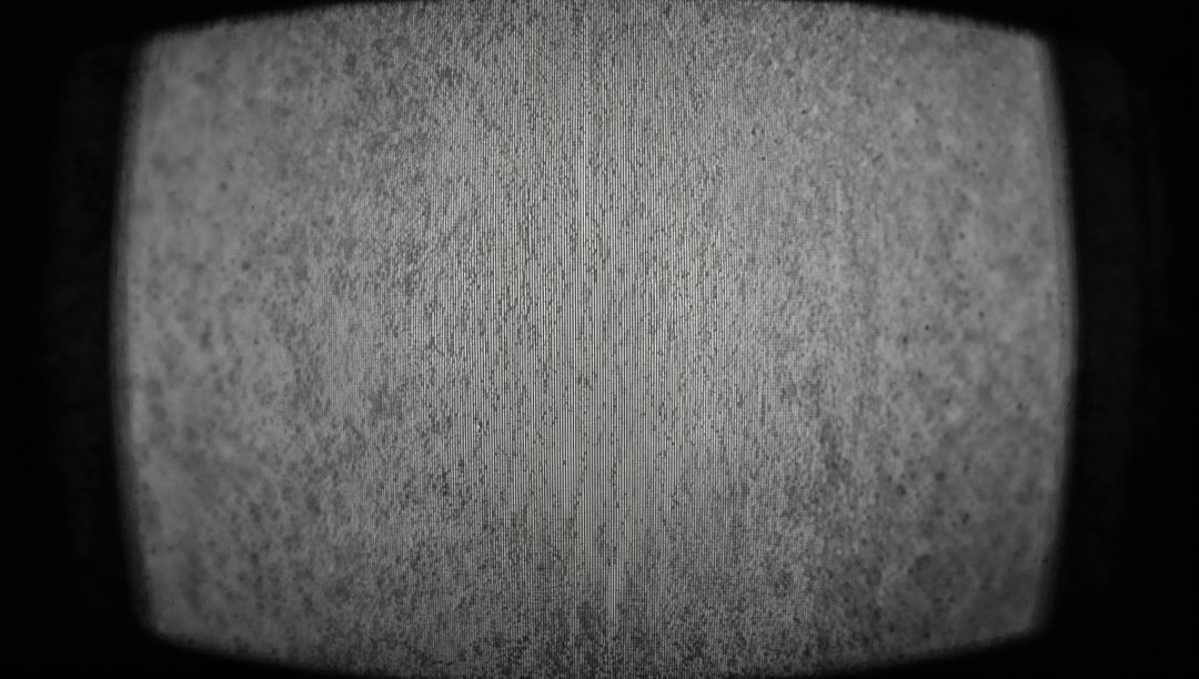 Monochrome Static Noise on Vintage TV Screen