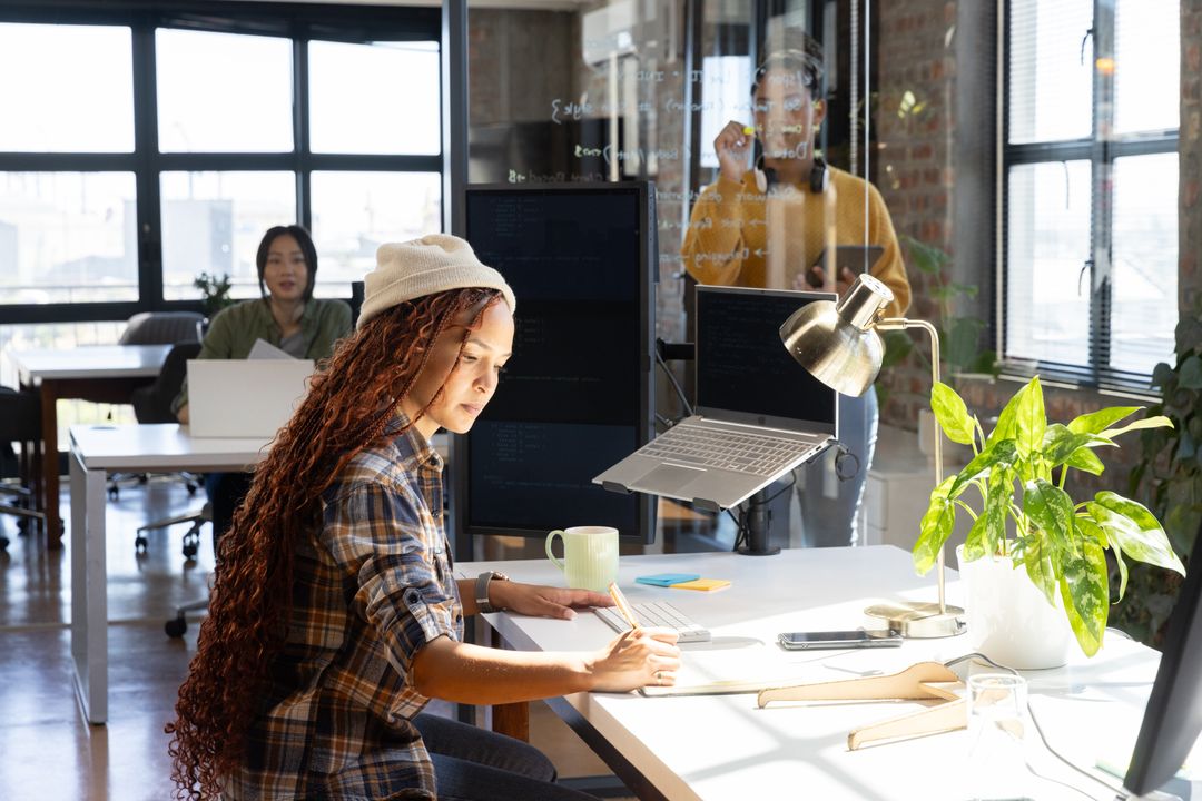 Diverse Coworkers Collaborating in Modern Office Workspace