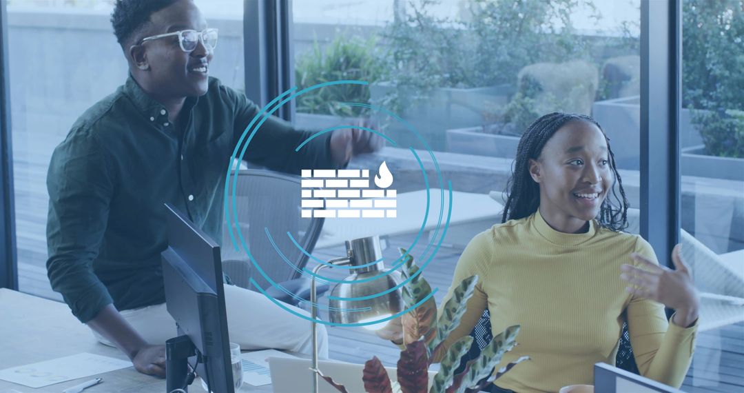 Professionals collaborating on cybersecurity with firewall hologram in modern office