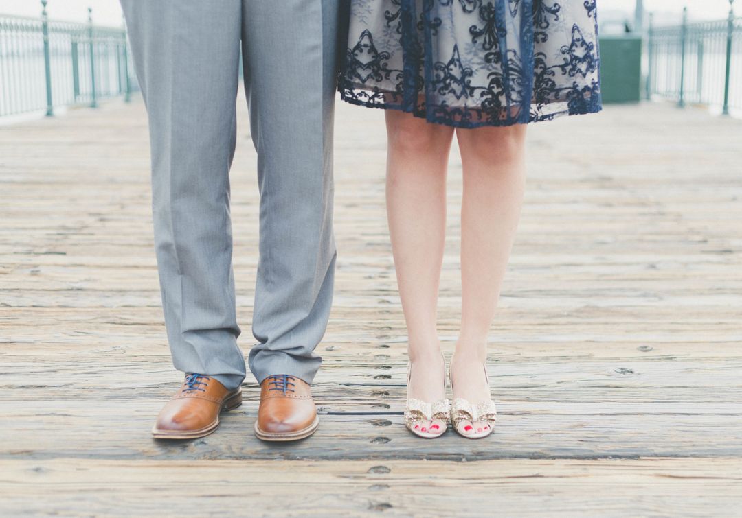 Couple's Feet on Wooden Boardwalk in Formal Attire - Free Images, Stock Photos and Pictures on Pikwizard.com