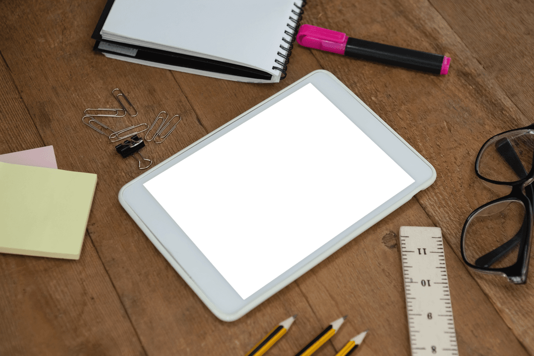 Transparent Tablet on Wooden Table with School Supplies
