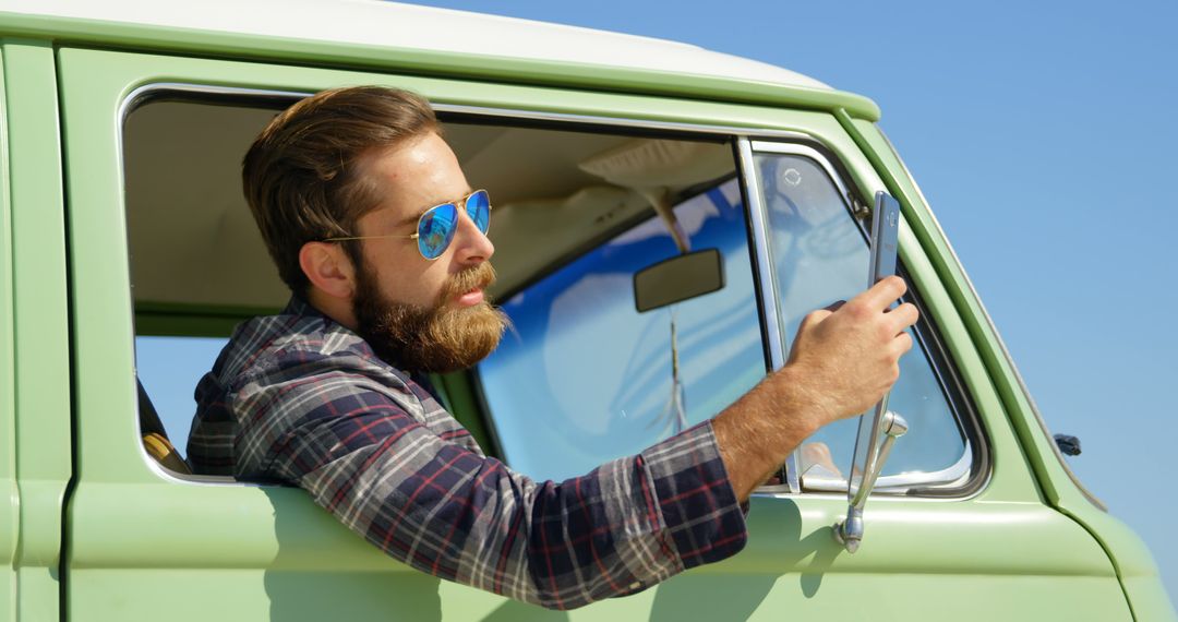 Bearded Man Taking Selfie in Vintage Van on Clear Sky Day - Free Images, Stock Photos and Pictures on Pikwizard.com