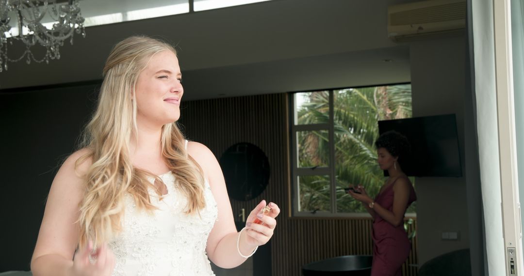 Joyful Bride and Supportive Bridesmaid Preparing for Ceremony