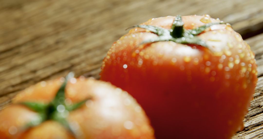 Close-up of Dewy Red Tomatoes on Rustic Wood