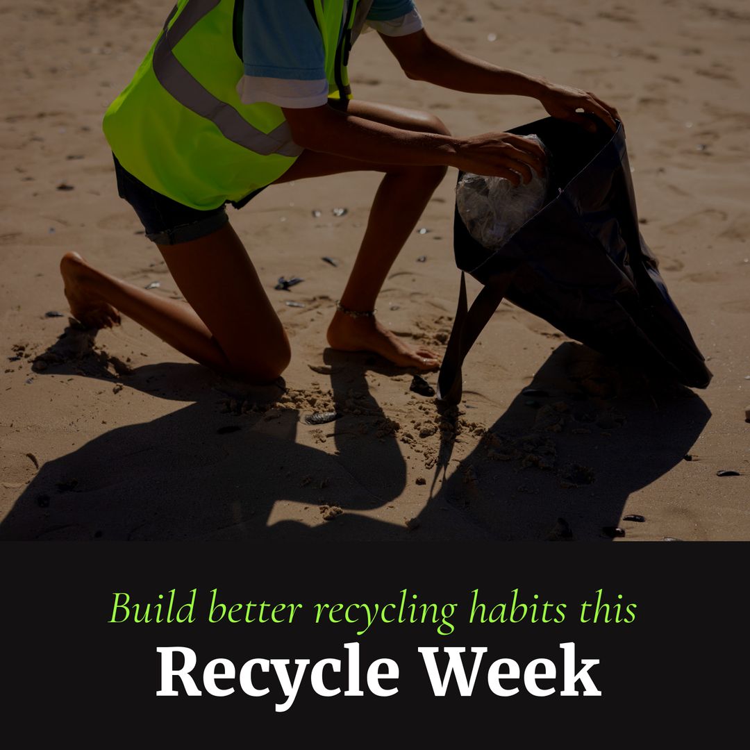 Volunteer Picking Up Trash on Beach for Recycle Week