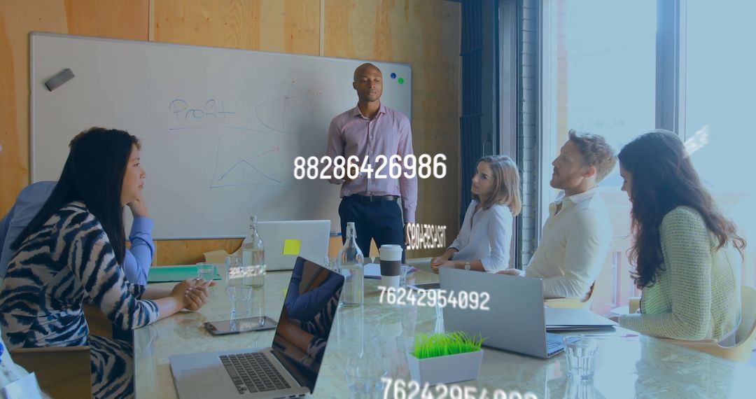 Diverse Team Discussing Data in Modern Office Meeting