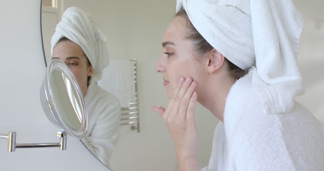 Woman in Bathroom Applying Skincare After Shower - Free Images, Stock Photos and Pictures on Pikwizard.com