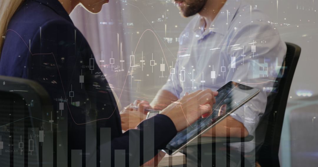 Business Team Analyzing Market Data on Tablet