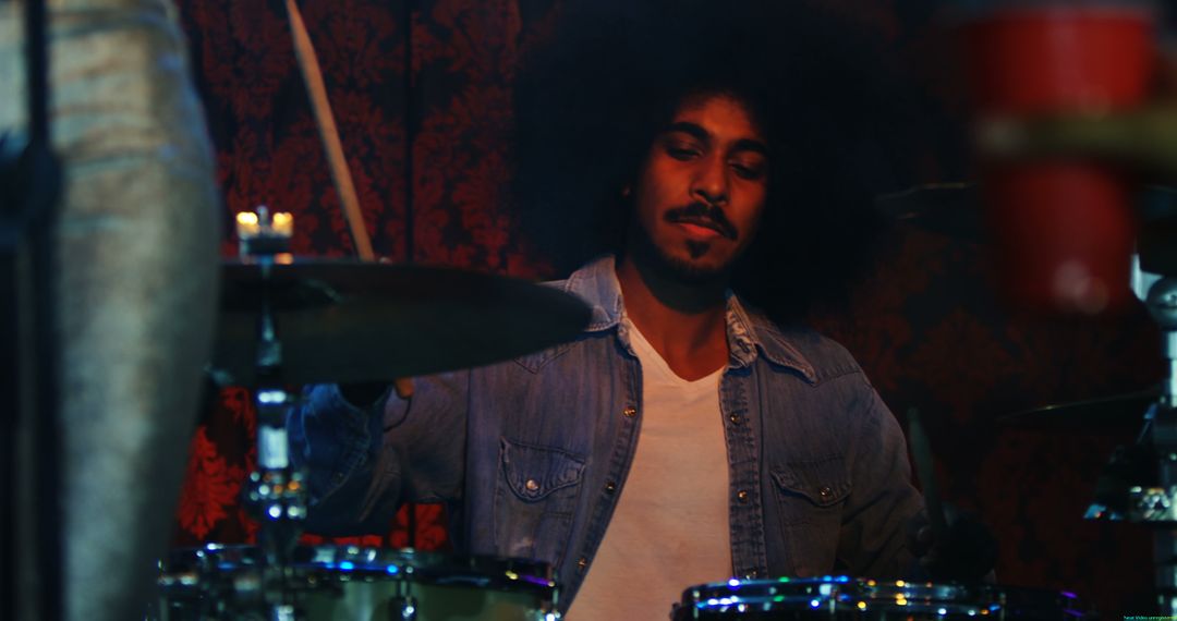 A young African American male musician plays the drums passionately, with copy space - Free Images, Stock Photos and Pictures on Pikwizard.com