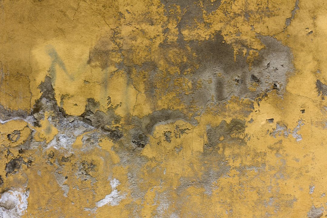 Close-Up of Weathered Yellow Wall with Peeling Paint and Textured Surface - Free Images, Stock Photos and Pictures on Pikwizard.com