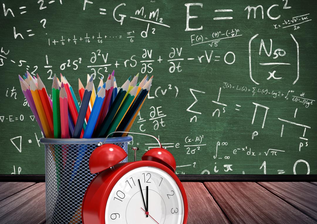 Alarm Clock and Colorful Pencils with Mathematical Formulas on Chalkboard - Free Images, Stock Photos and Pictures on Pikwizard.com
