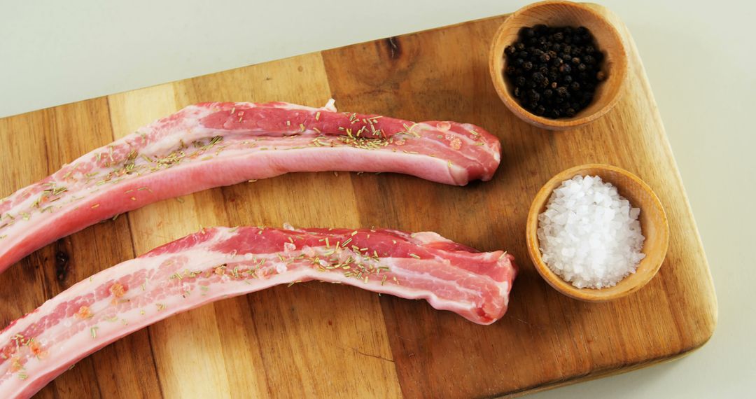 Raw Pork Ribs with Seasonings on Wooden Board - Free Images, Stock Photos and Pictures on Pikwizard.com