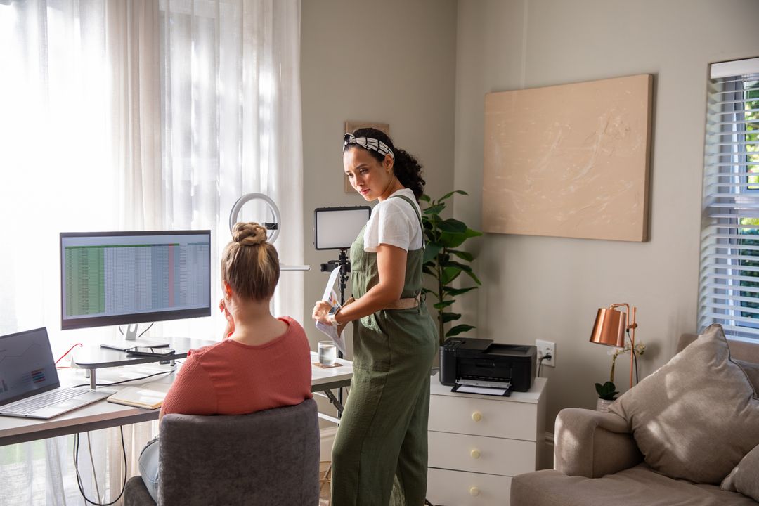 Diverse Women Collaborating in Home Office with Modern Technology