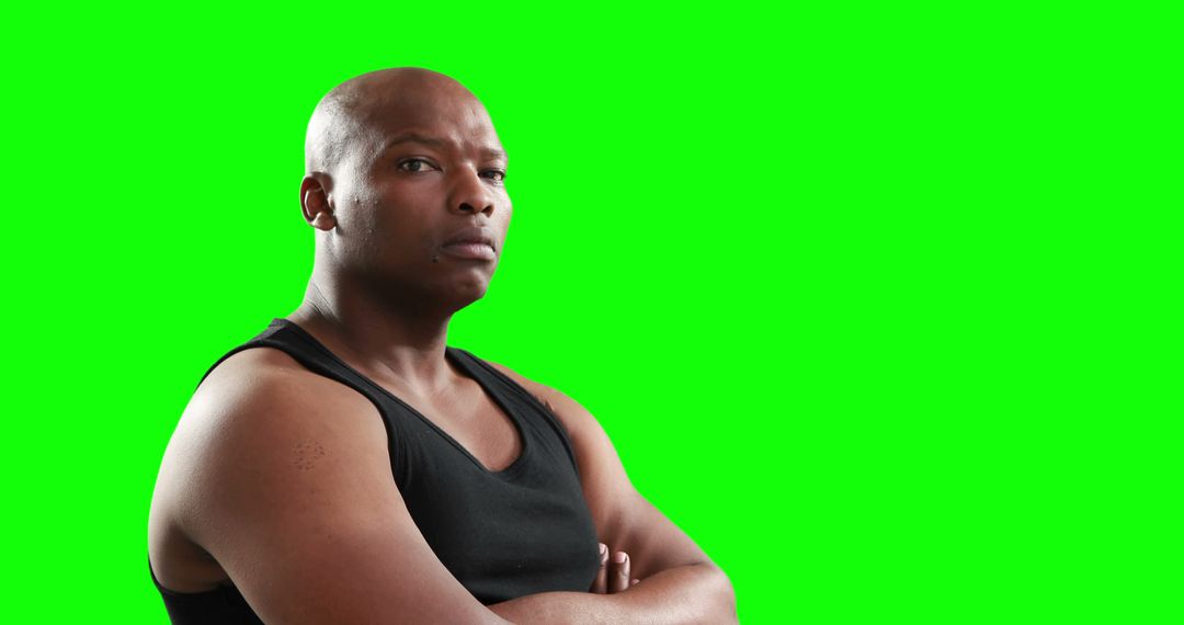 Confident African American Man in Black Tank Top with Green Screen Background - Free Images, Stock Photos and Pictures on Pikwizard.com