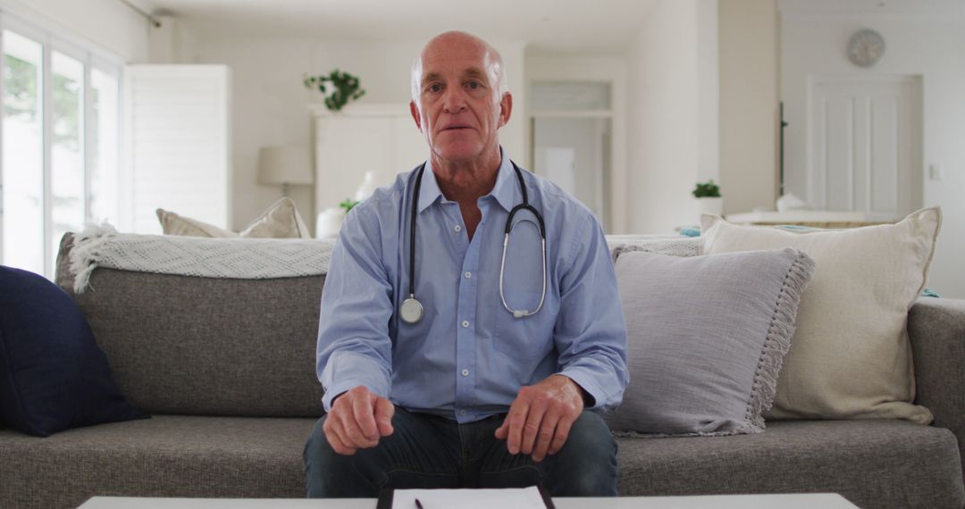 Senior Doctor Giving Medical Advice in Living Room - Free Images, Stock Photos and Pictures on Pikwizard.com