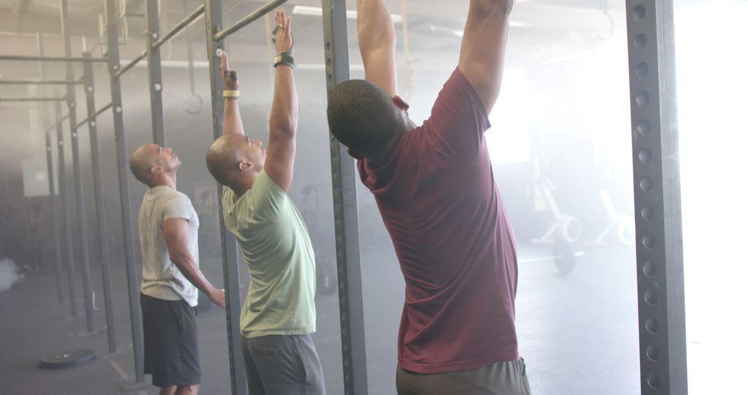 Group of Multiracial Men Exercising with Pull-up Bar at Gym - Free Images, Stock Photos and Pictures on Pikwizard.com