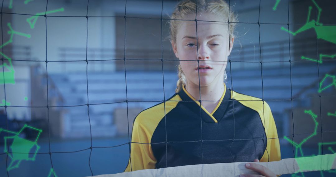 Teenage Volleyball Player Gripping Net Tape in School Gym with Green Data Overlays