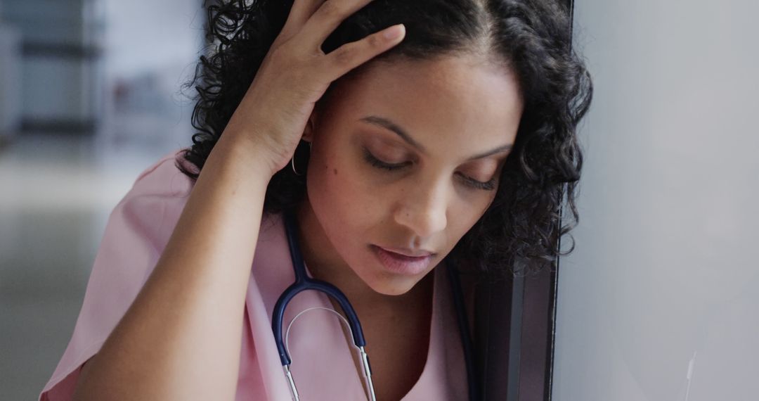 Stressed Healthcare Professional with Stethoscope in Hospital - Free Images, Stock Photos and Pictures on Pikwizard.com