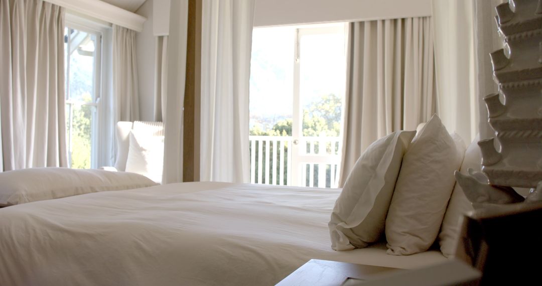 Serene Bedroom with Soft Sunlight and Open Balcony Doors