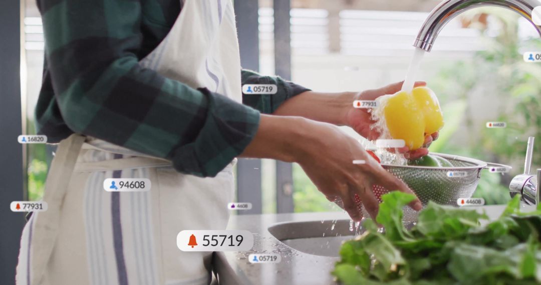 Woman Rinsing Bell Pepper in Modern Kitchen with Notifications