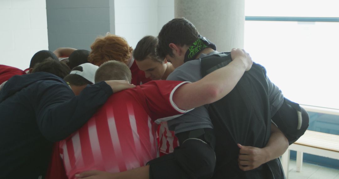 Team Huddle of Young Male Athletes in Locker Room - Free Images, Stock Photos and Pictures on Pikwizard.com