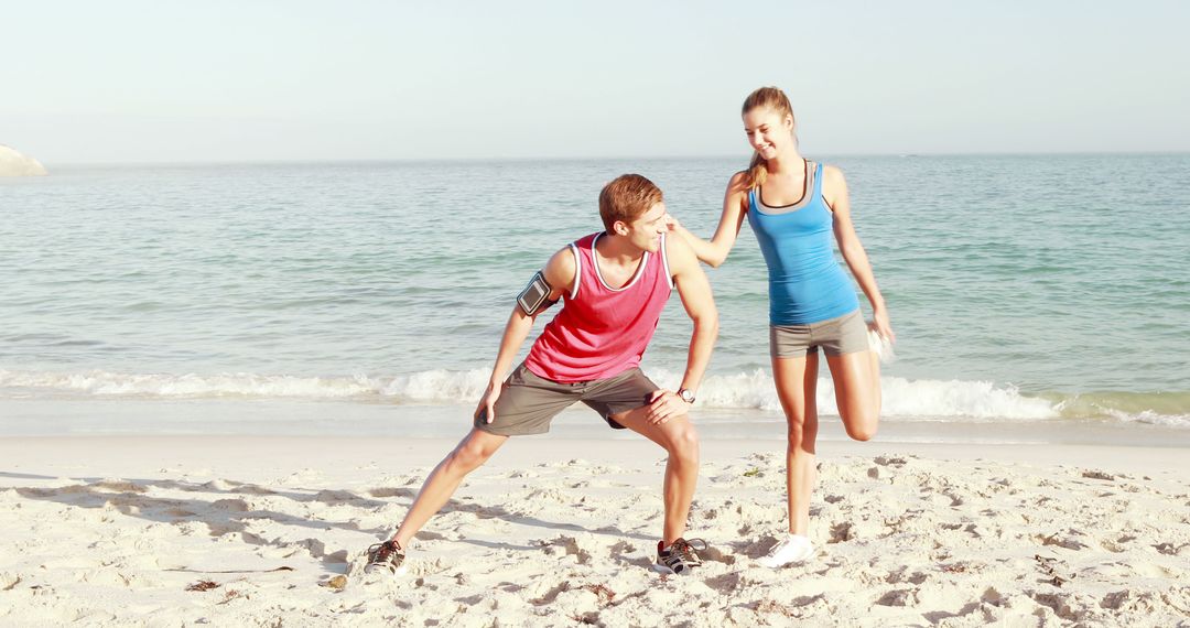 Couple Stretching on Beach for Morning Workout - Free Images, Stock Photos and Pictures on Pikwizard.com