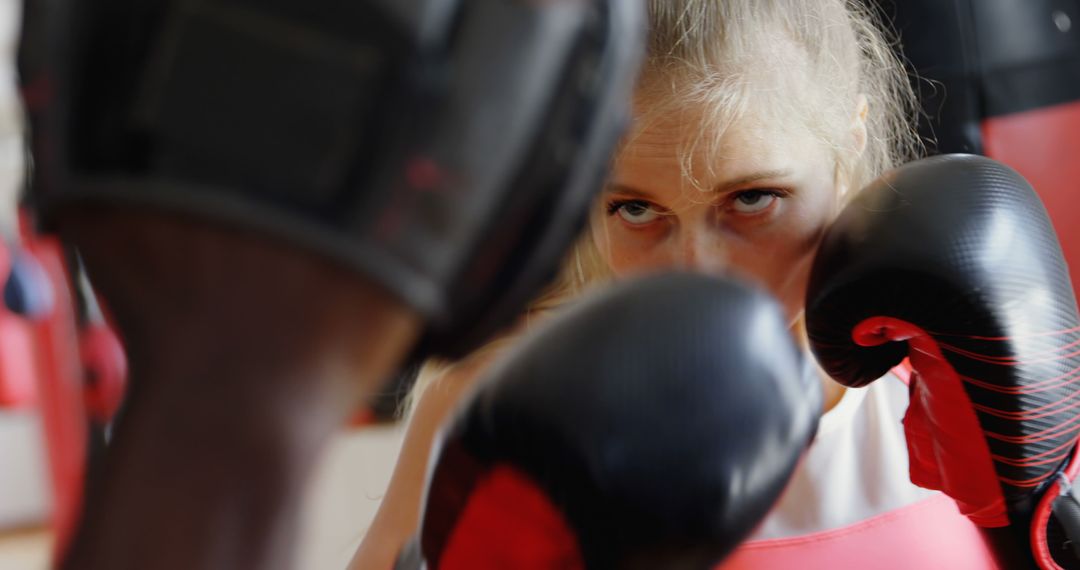 Focused Female Boxer Sparring During Training Session - Free Images, Stock Photos and Pictures on Pikwizard.com