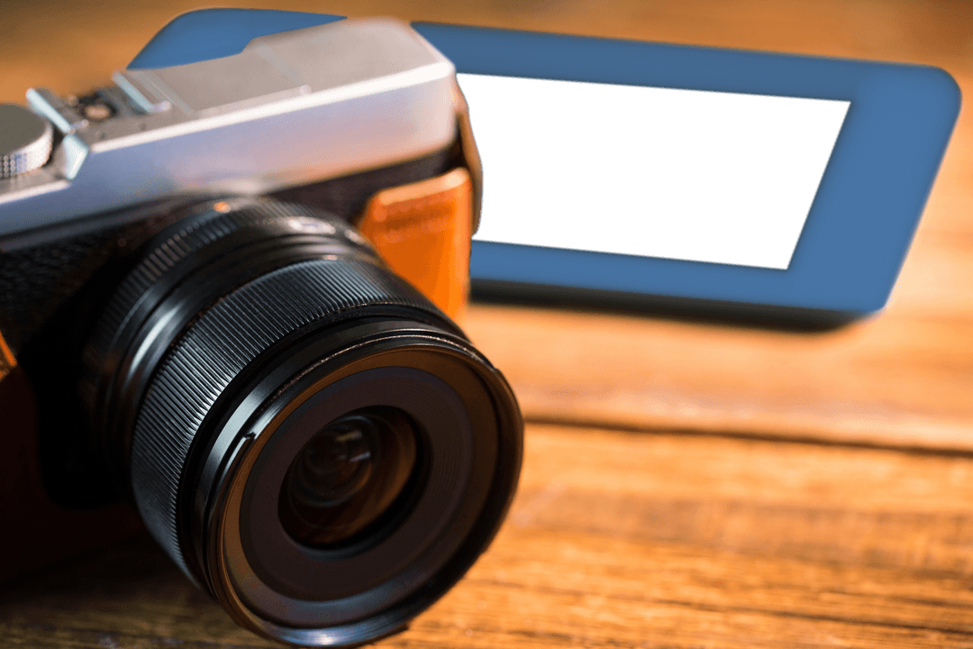 Transparent Camera and Tablet on Wooden Surface Close-Up