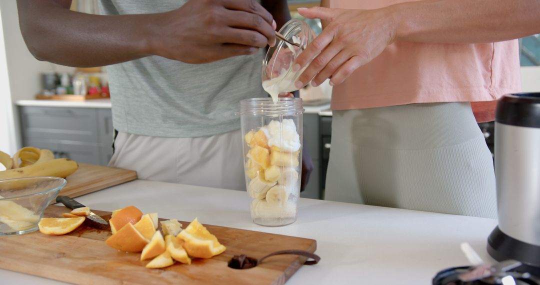 Diverse Couple Making Fruit Smoothie Together at Home