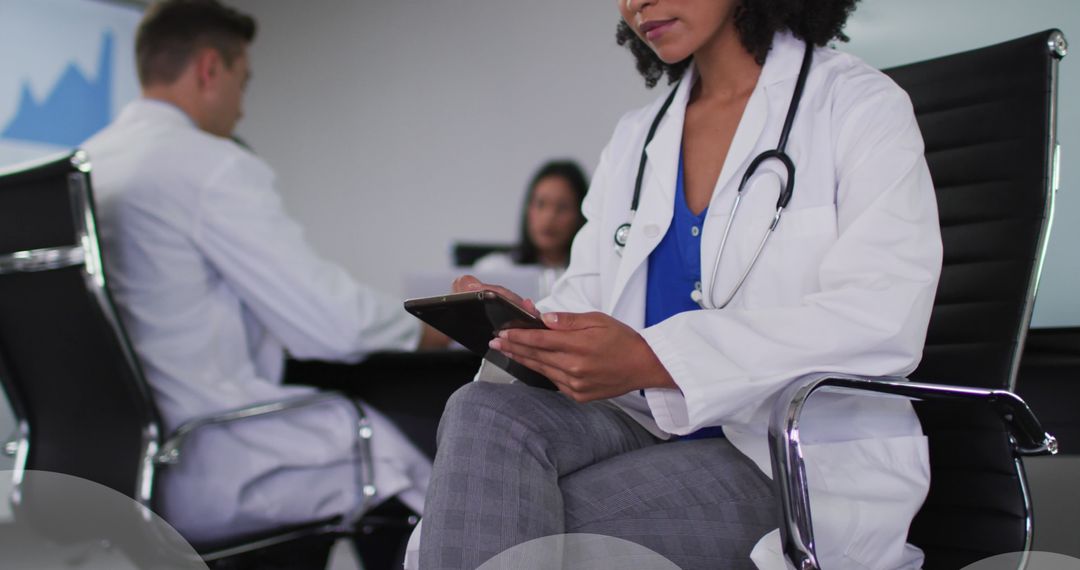 Female Doctor Using Tablet with Cloud Computing Overlay