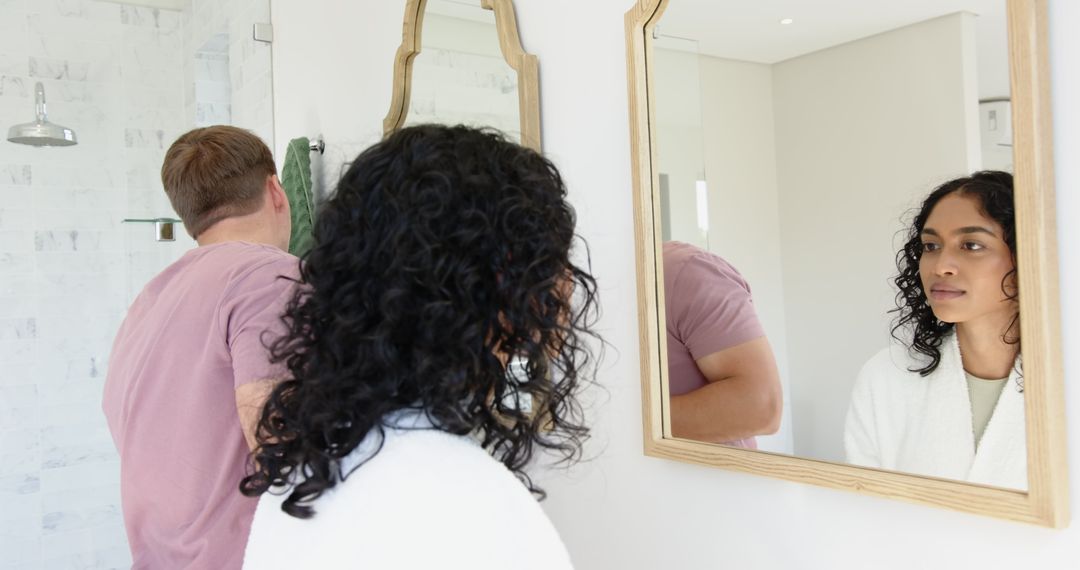Diverse Couple Using Bathroom Mirror in Elegantly Minimalist Setting