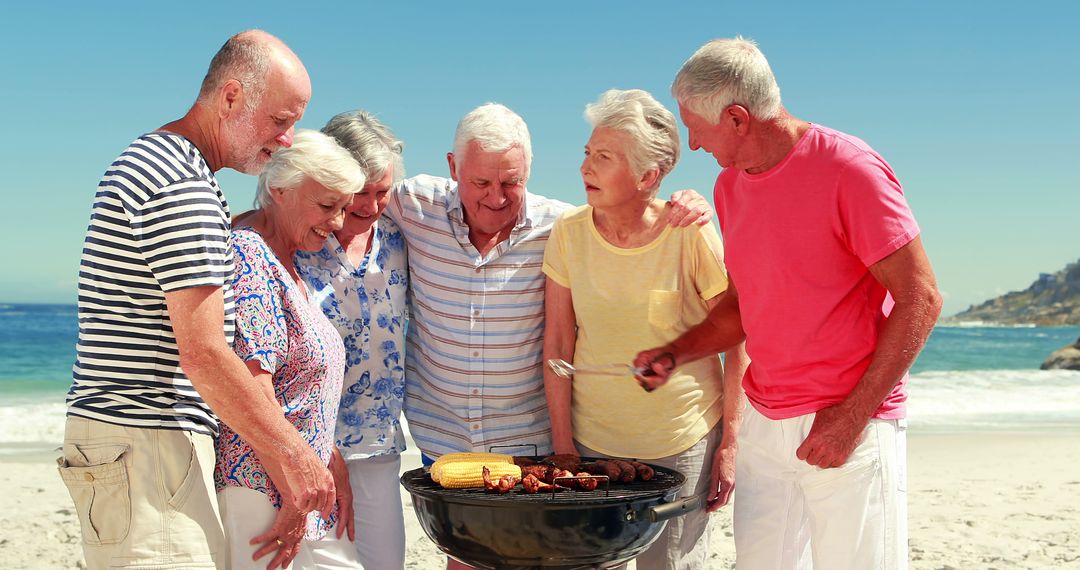 Senior Friends Having a Beach Barbecue Under Sunny Sky - Free Images, Stock Photos and Pictures on Pikwizard.com