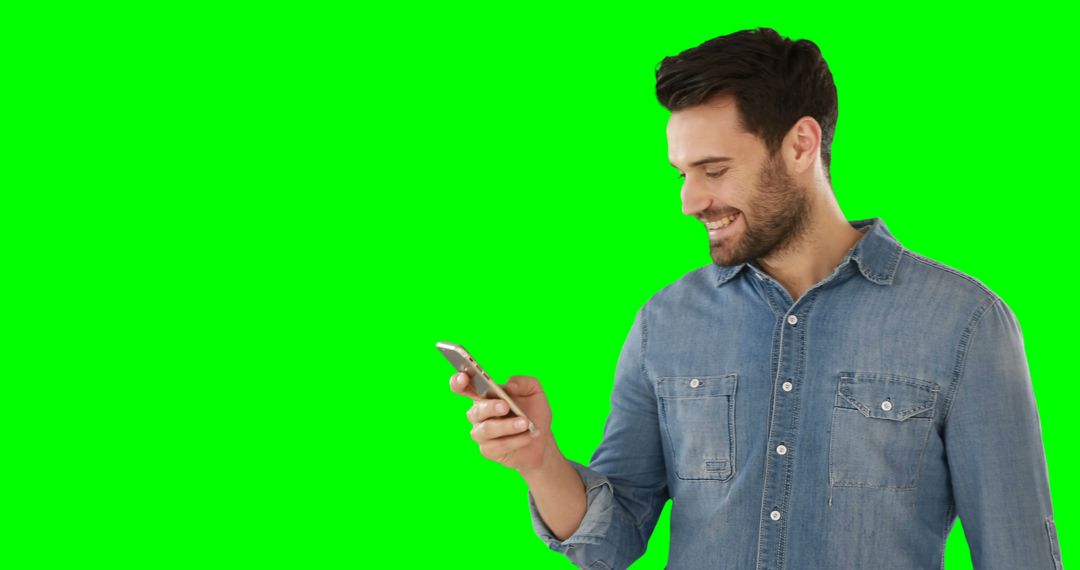 Smiling Man Using Smartphone on Green Screen Background - Free Images, Stock Photos and Pictures on Pikwizard.com