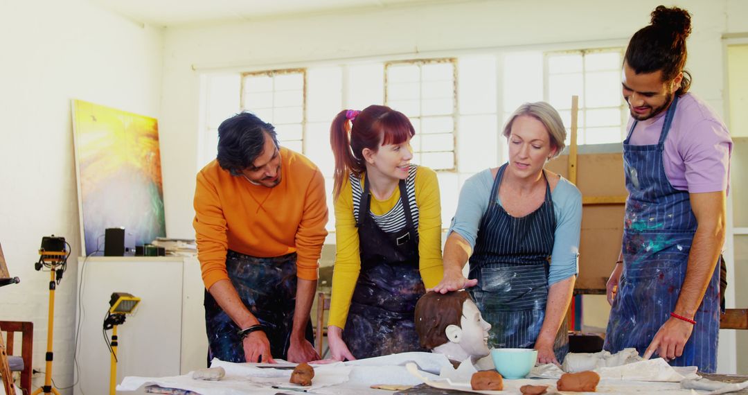 Diverse Adults Engaging Collaboratively in Pottery Class