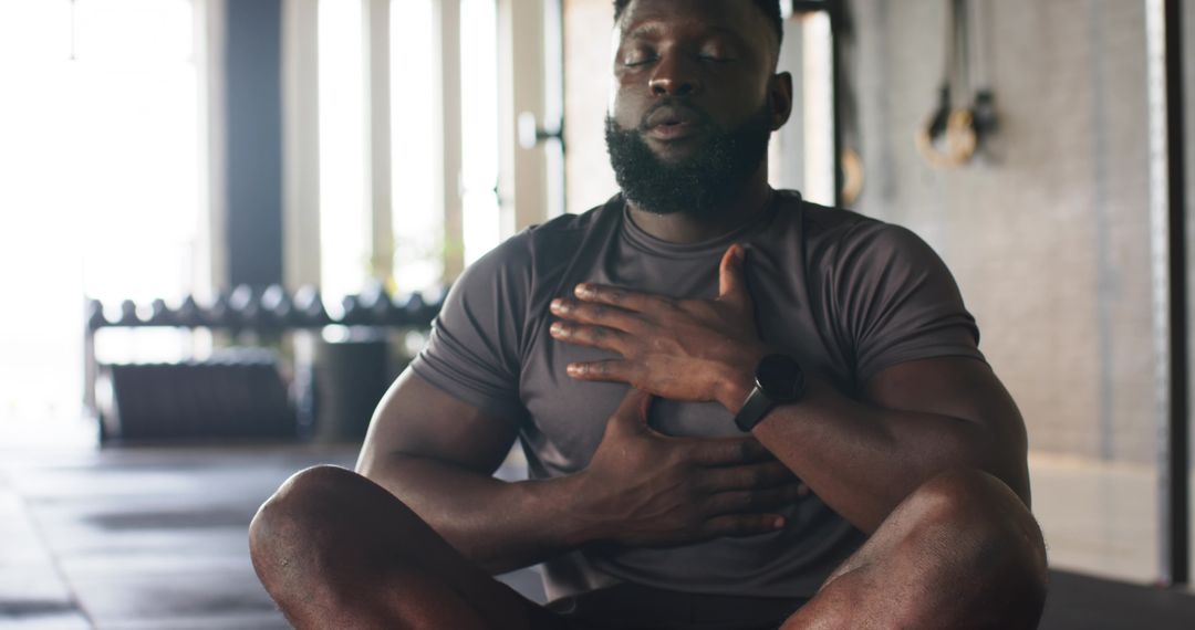 Man Meditating in Gym for Mindfulness and Strength