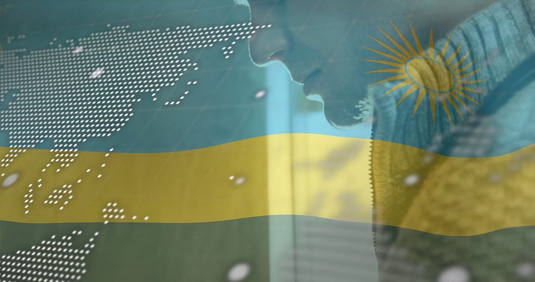 Man Analyzing Digital World Map with Rwanda Sun Emblem in Background