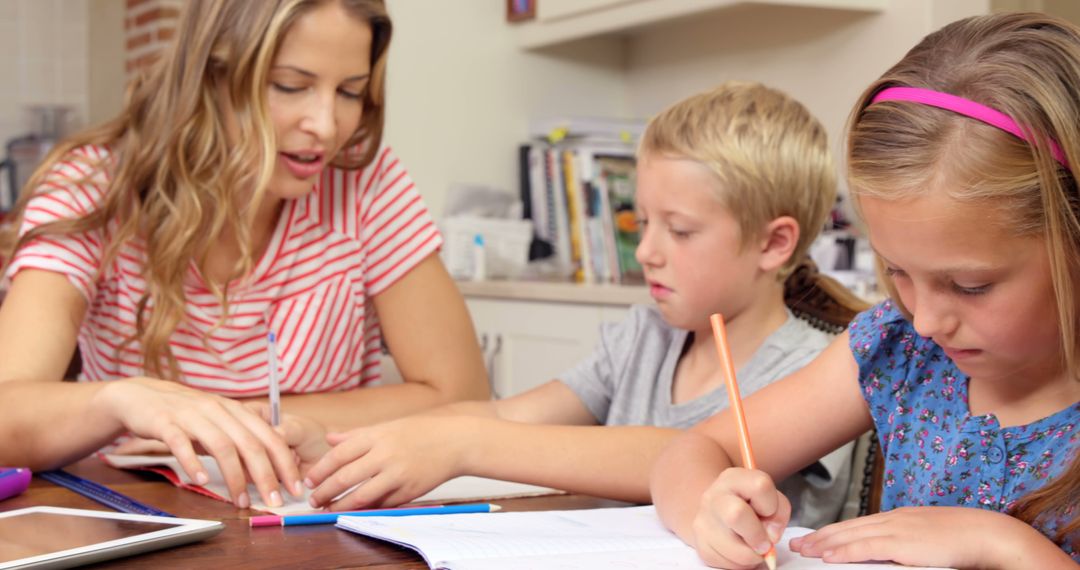 Mother Helping Children with Homework at Cozy Home Setting - Free Images, Stock Photos and Pictures on Pikwizard.com