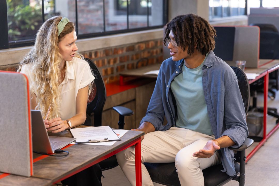 Diverse Professionals Engaging in Workplace Collaboration
